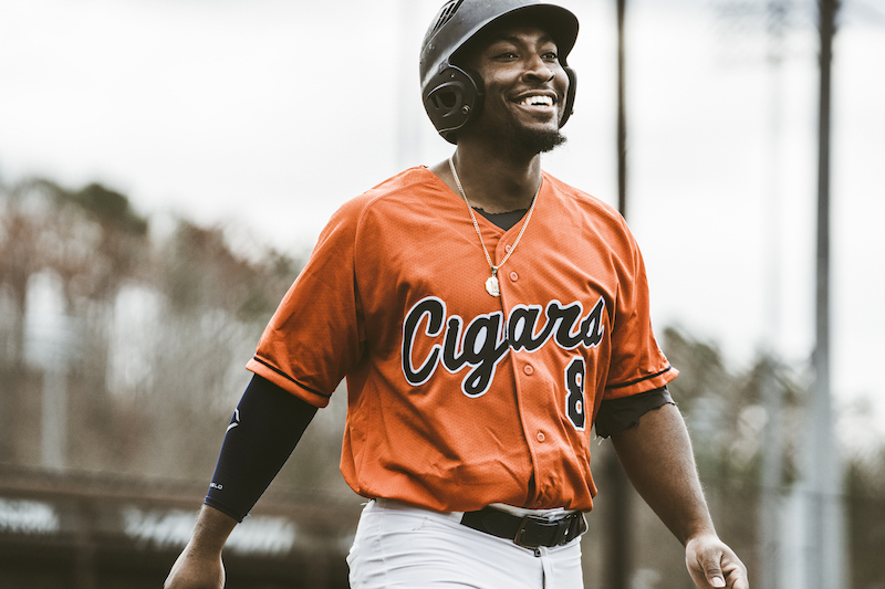 Cigars player #8 celebrating during game action