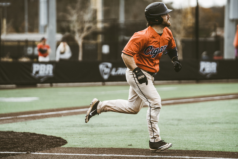 Cigars player running the bases during game